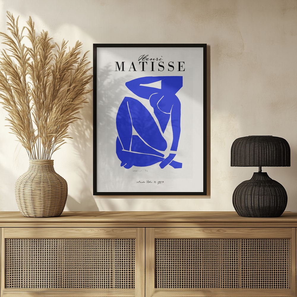 Ausstellungsplakat Henri Matisse mit blauem Scherenschnitt einer sitzenden Figur