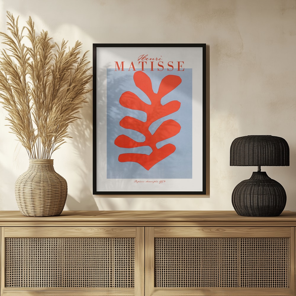 Ausstellungsplakat Henri Matisse mit korallenrotem Scherenschnitt-Blatt auf hellblauem Grund, roter Schriftzug