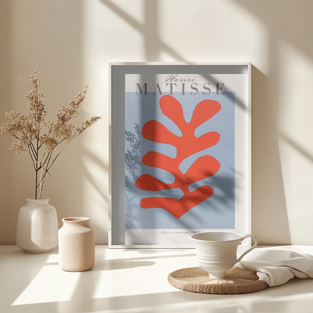 Ausstellungsplakat Henri Matisse mit korallenrotem Scherenschnitt-Blatt auf hellblauem Grund, grauer Schriftzug