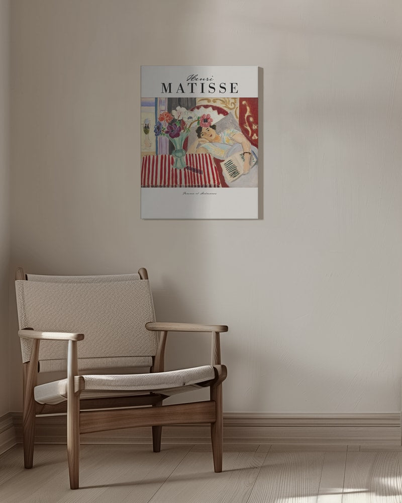 Ausstellungsplakat Henri Matisse mit Frau neben einer Vase mit Anemonen in einem bunten Interieur