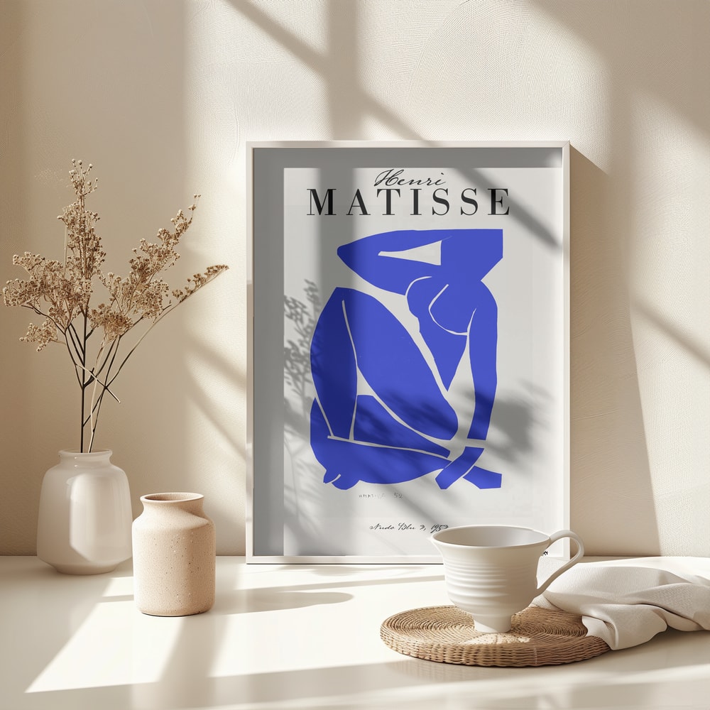 Ausstellungsplakat Henri Matisse mit blauem Scherenschnitt einer sitzenden Figur