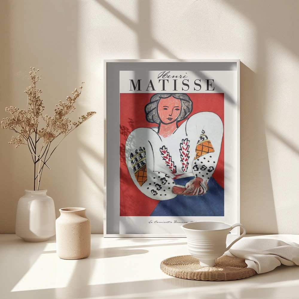 Ausstellungsplakat Henri Matisse mit Frau in bestickter weißer Bluse vor rotem Hintergrund