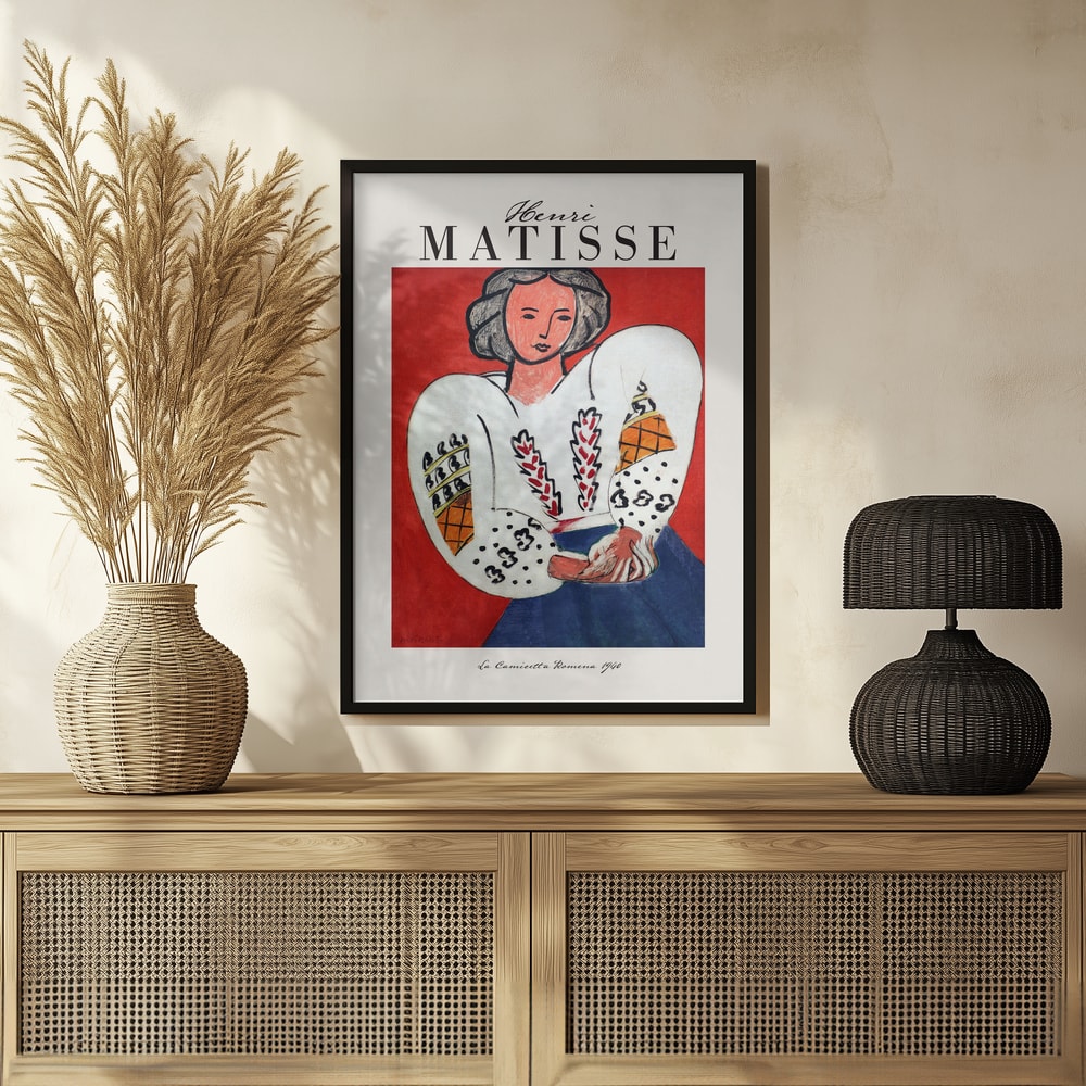 Ausstellungsplakat Henri Matisse mit Frau in bestickter weißer Bluse vor rotem Hintergrund